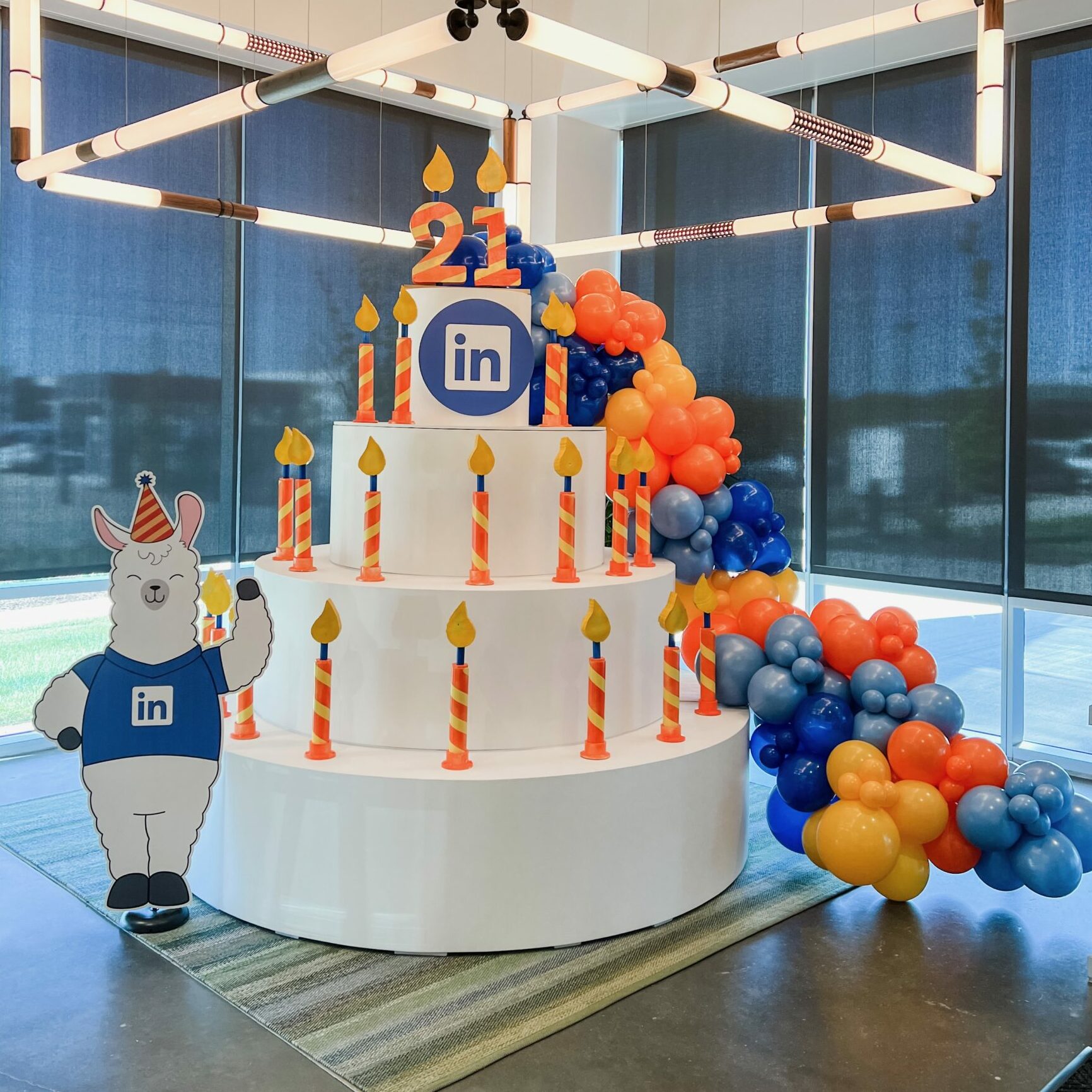 Custom 10ft H Wooden Birthday Cake with Candles & Branding for LinkedIn's 21st Birthday